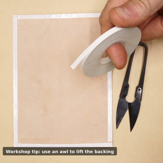 5mm double sided tape being applied to leather during wallet making